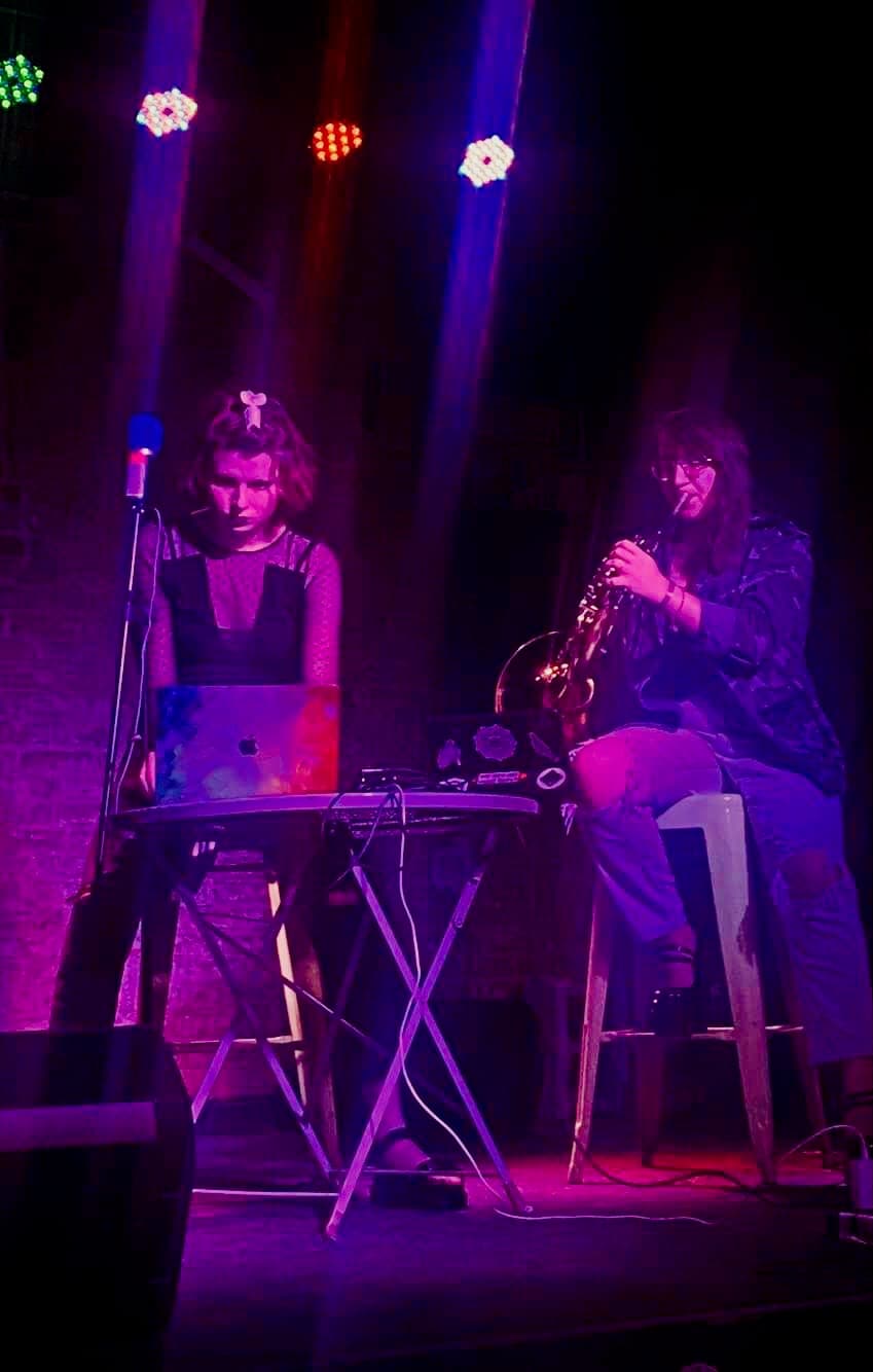 Addison on stage with electronics